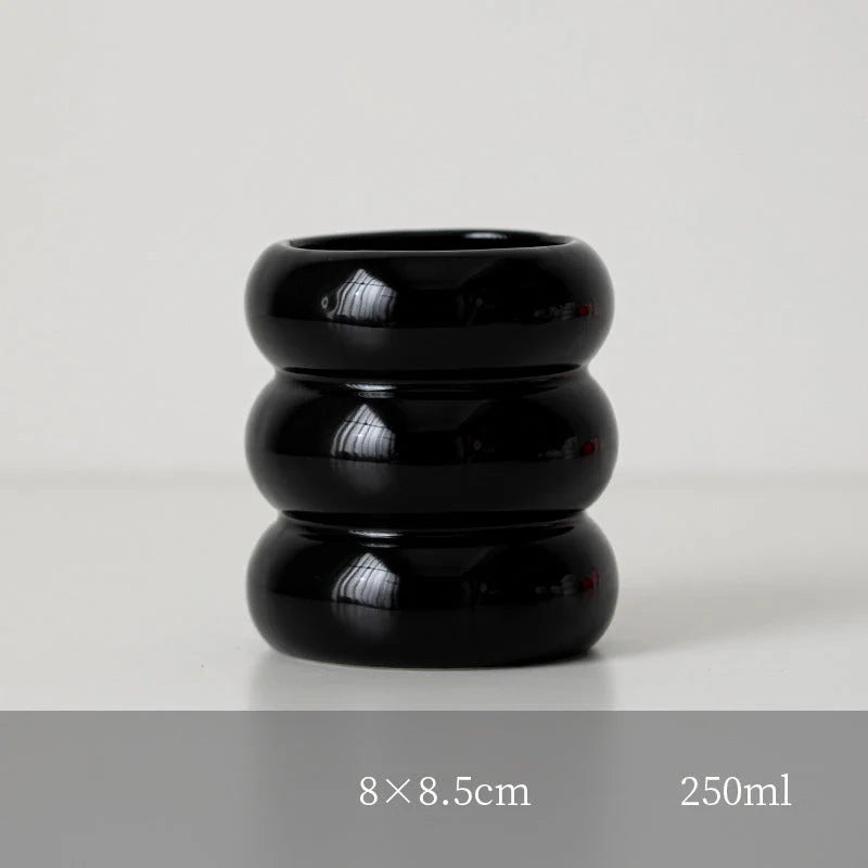 A white ceramic candlestick holder with a minimalist Nordic design, perfect for creating a cosy and sophisticated ambience in any room.