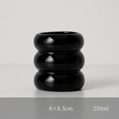 A white ceramic candlestick holder with a minimalist Nordic design, perfect for creating a cosy and sophisticated ambience in any room.