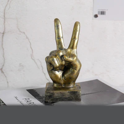 Elegant resin gesture ornaments in a variety of classic bronze and silver finishes, perfect for adding a charming accent to British-inspired home decor