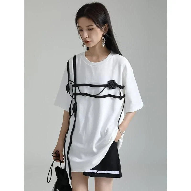 A stylish black and white floral half-sleeve casual t-shirt with a classic round neckline, perfect for everyday wear.