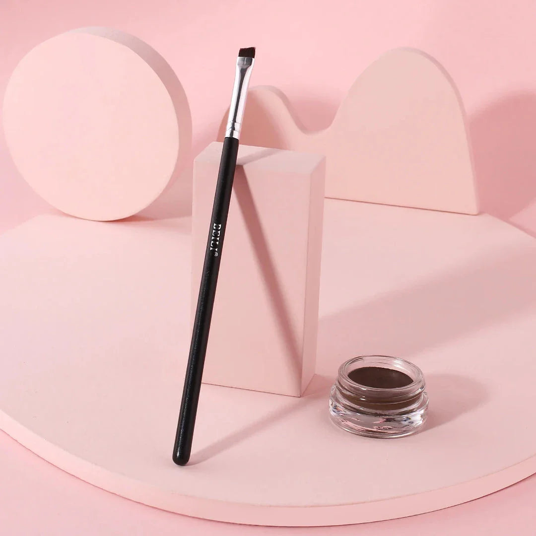 Professional black eyebrow and eyeliner makeup brush with sleek wooden handle for precise, salon-quality results