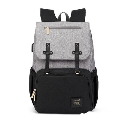A stylish and practical mummy backpack with multiple pockets, perfect for organising and transporting all your parenting essentials.