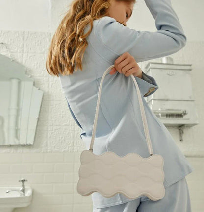 Premium embossed pearl chain handbag in fashionable shades with a soft, comfortable handle for hands-free carrying