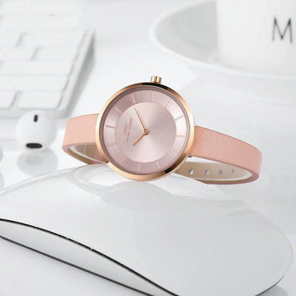 Stylish slim ladies' waterproof watch in various colours, including black, tan, grey, and white, with rose gold or silver accents.
