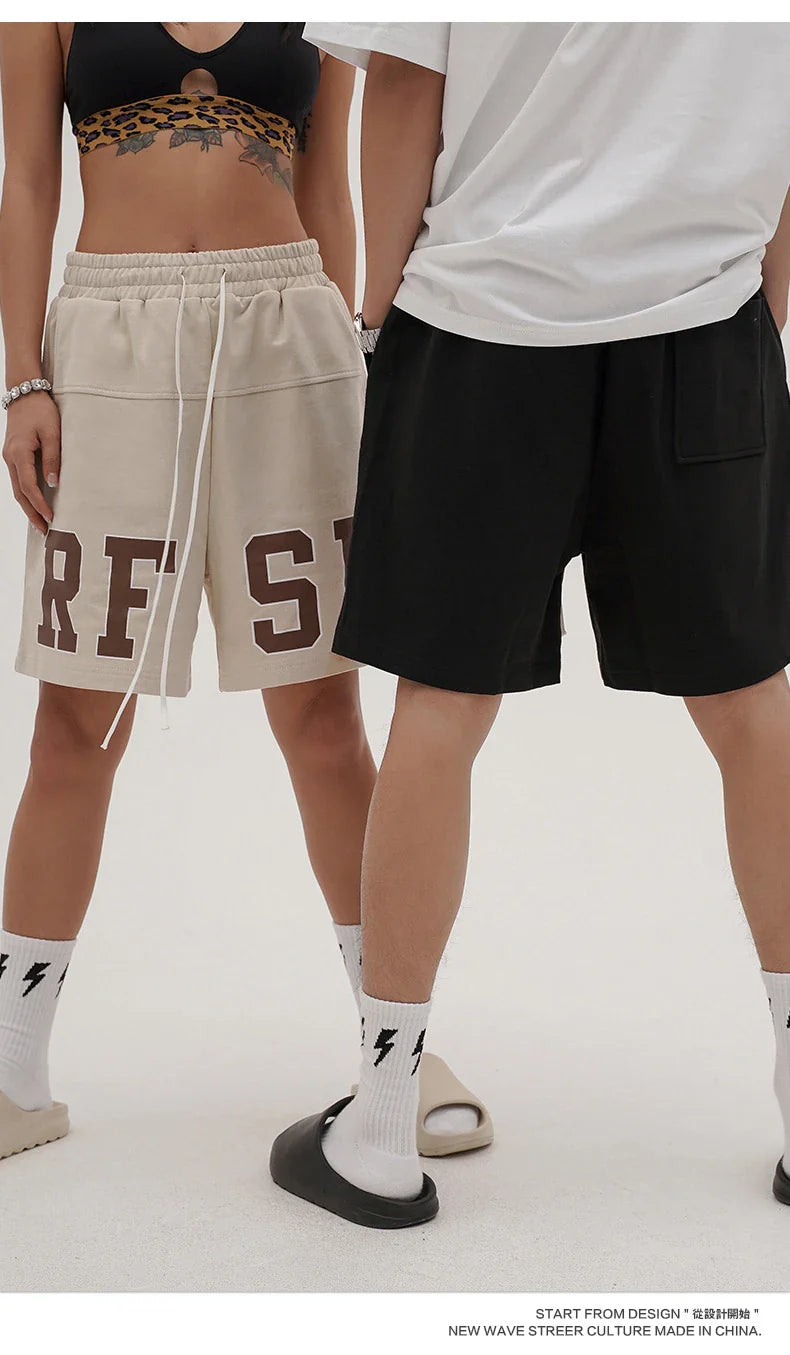 Premium loose-fit sports shorts with eye-catching printed patterns in black, khaki, and dark grey colours