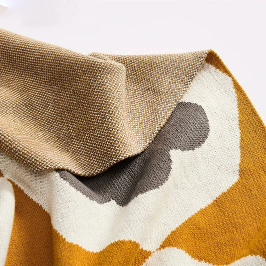 Floral knitted cotton throw blanket in a cosy Matcha Green colour, perfect for British homes and outdoor adventures.