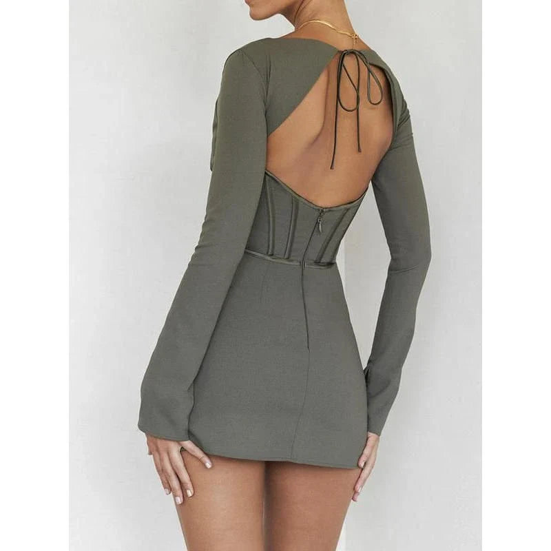 Elegant backless mini dress with full sleeves, made from a premium cotton-polyester blend for comfort and durability.