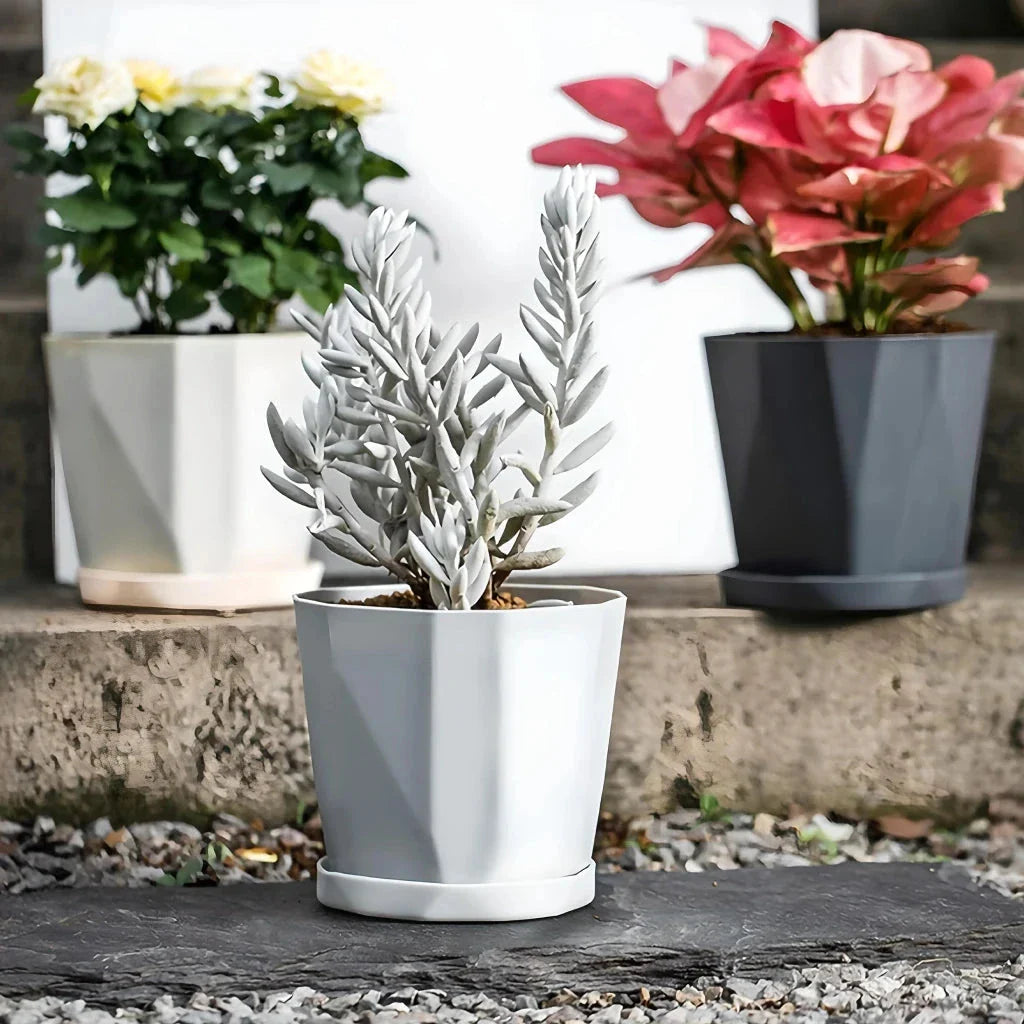 Nordic-style resin flower pot in grey, featuring a minimalist design and suitable for indoor use in UK homes and offices