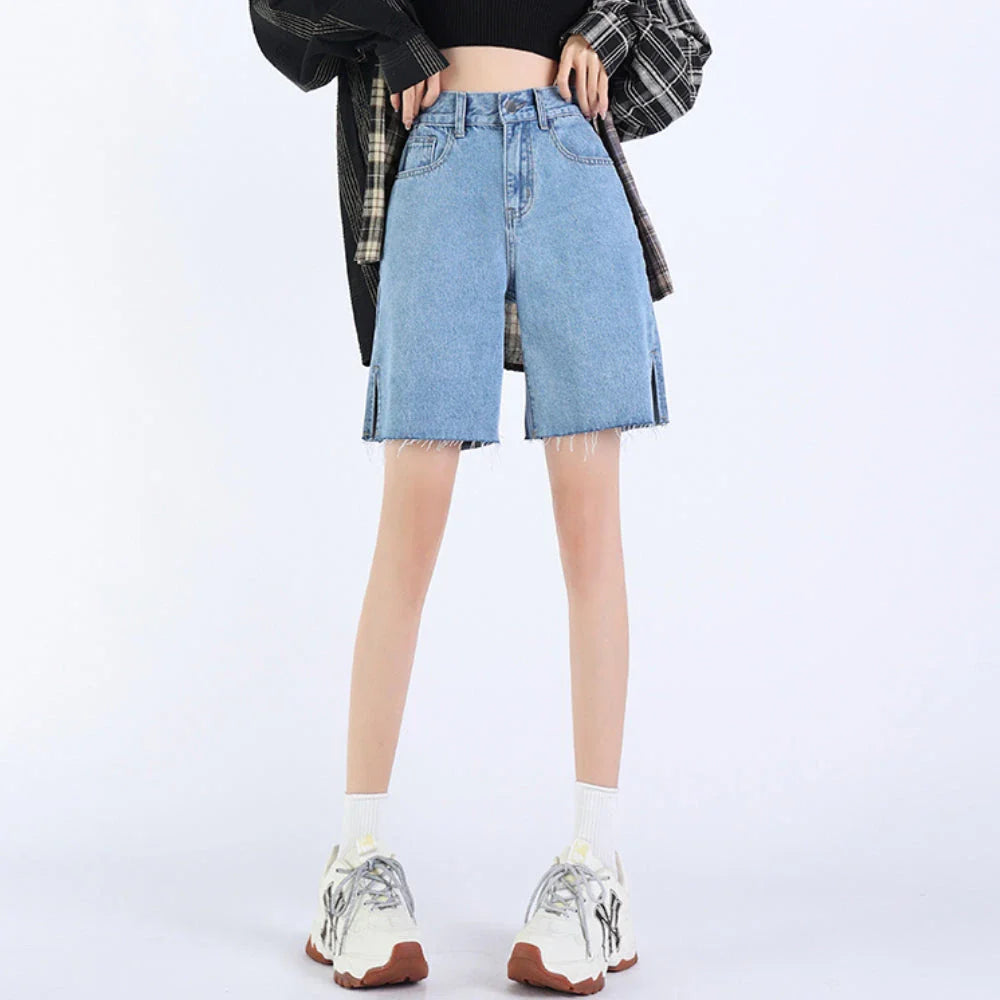 Premium high-rise wide-leg denim shorts in blue, featuring a flattering silhouette and practical pockets