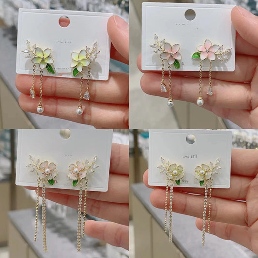 Elegant zircon flower long pearl tassel earrings in silver and gold tones, showcasing a captivating floral design and luxurious cascading tassels