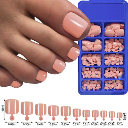 Elegant short square press-on toenails in vibrant pink, red, and nude shades for a polished and convenient pedicure