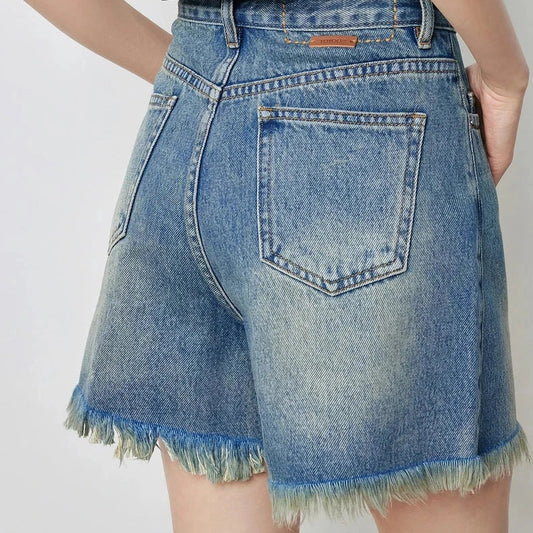 Vintage-inspired high-waisted denim shorts with tassel detailing for women
