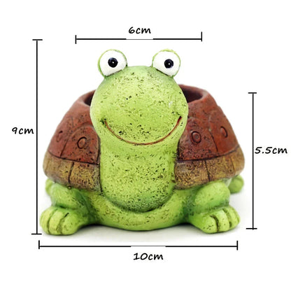 A charming, hand-painted resin planter in the shape of a cartoon turtle, perfect for displaying succulents, cacti, and other small plants.