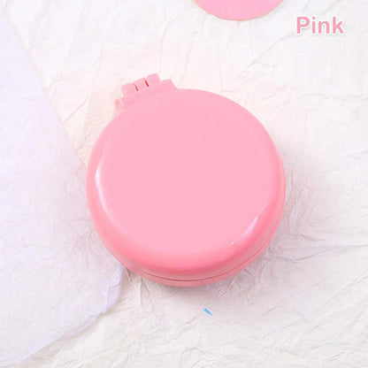 Compact folding hair comb with mirror, perfect for on-the-go touch-ups and styling for British customers