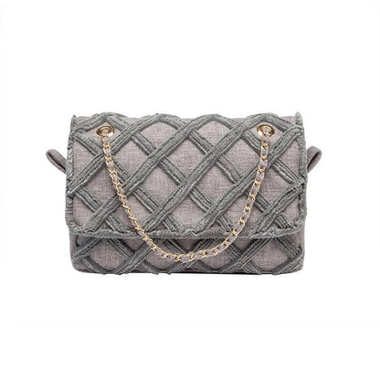 A stylish, retro-inspired shoulder bag with a minimalist rhombus pattern design, perfect for the modern, fashion-conscious woman in the UK.