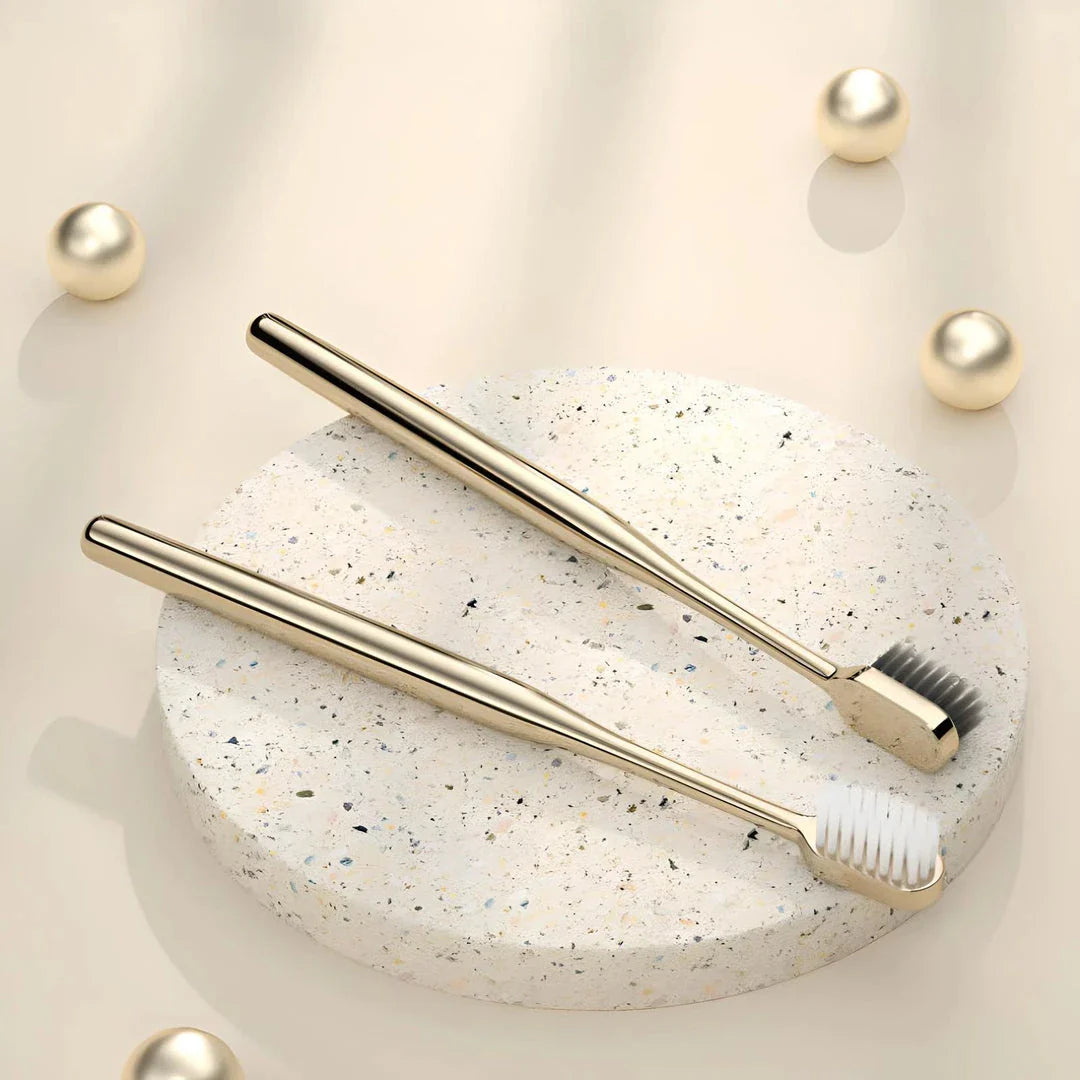 Elegant gold and silver toothbrush with soft bristles for superior dental hygiene
