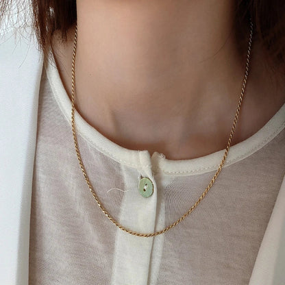 Sterling silver necklace with coastal-inspired fried dough twist design, handcrafted in the UK