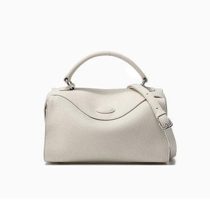 Premium British cowhide leather shoulder bag with multiple interior pockets and adjustable strap for versatile wear