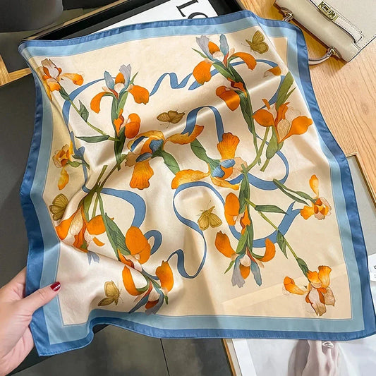 Luxurious floral 100% silk square scarf for women, featuring a charming print and versatile design.