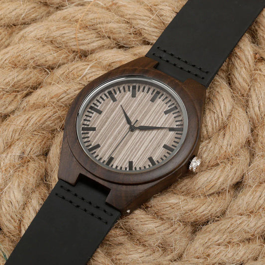 A stylish wood-cased dress watch with a brown dial and unique engraved lettering on the back