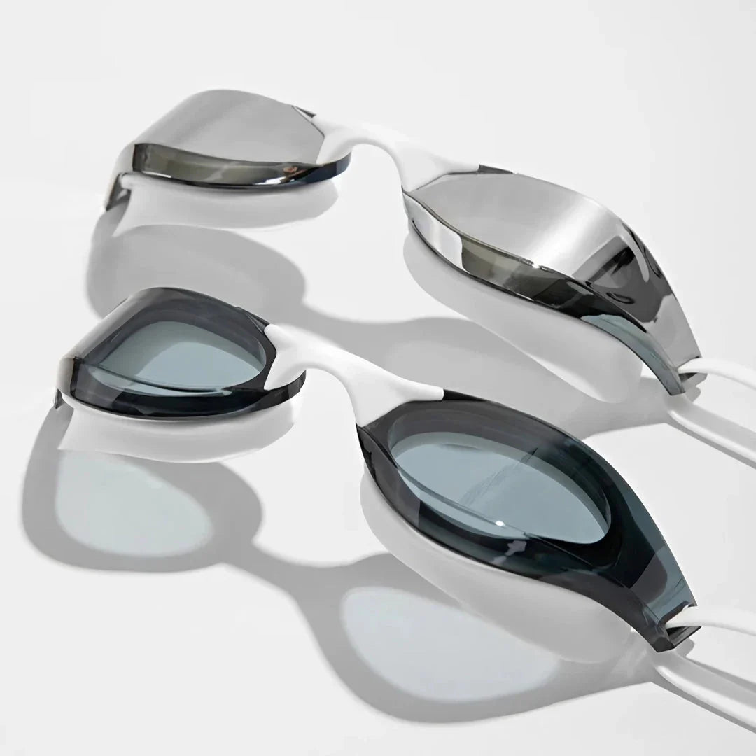 Premium British-made swimming goggles with anti-fog and UV protection technology, designed for clear visibility and comfort in pools, beaches, and water parks.