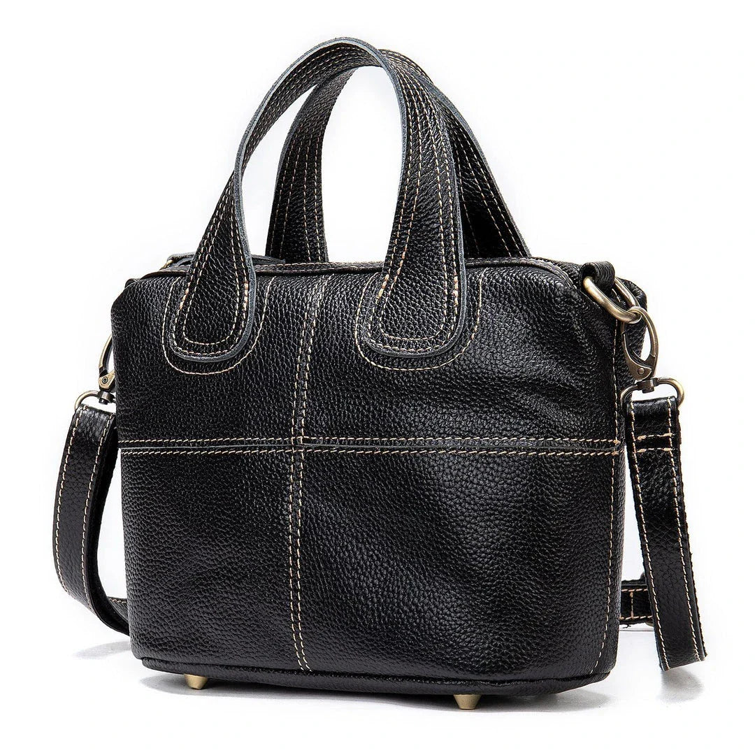Premium leather shoulder bag for women in red, blue, and black colours with spacious interior and comfortable strap