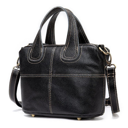 Premium leather shoulder bag for women in red, blue, and black colours with spacious interior and comfortable strap