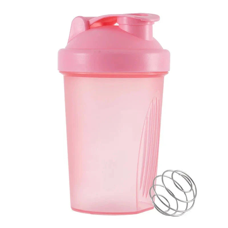 Premium protein shaker bottle with stainless steel whisk ball, BPA-free plastic, and leak-proof design for on-the-go fitness enthusiasts in the UK.