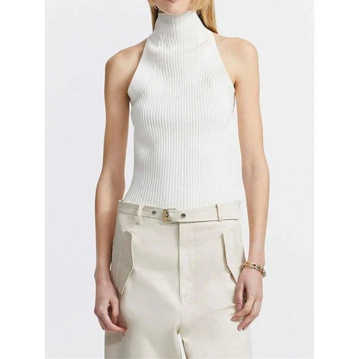 Elegant and versatile knitted sleeveless tank top with a unique hollow-out design, perfect for chic British style