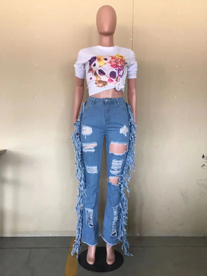 Stylishly distressed tassel jeans with light blue wash and straight-leg silhouette