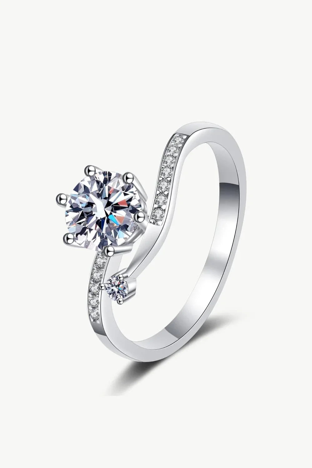 Elegant Moissanite and Sterling Silver Ring with a sparkling centre stone, delicate zircon accents, and a luxurious 925 sterling silver setting