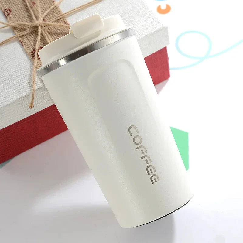 Stylish and durable stainless steel thermos mug with double-wall vacuum insulation, keeping drinks hot or cold for hours on end.