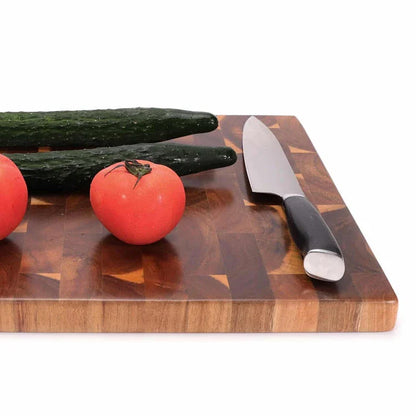 Premium Acacia wood chopping board with a convenient juice groove to catch liquids during food preparation