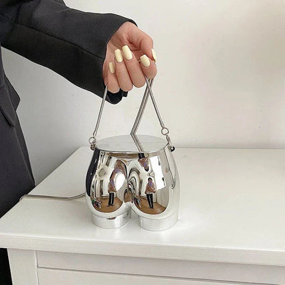 Elegant silver acrylic evening clutch bag with stylish chain strap for versatile carrying