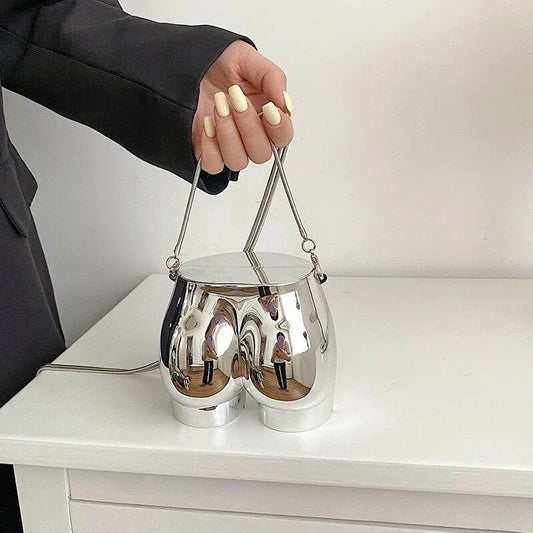 Elegant silver acrylic evening clutch bag with stylish chain strap for versatile carrying