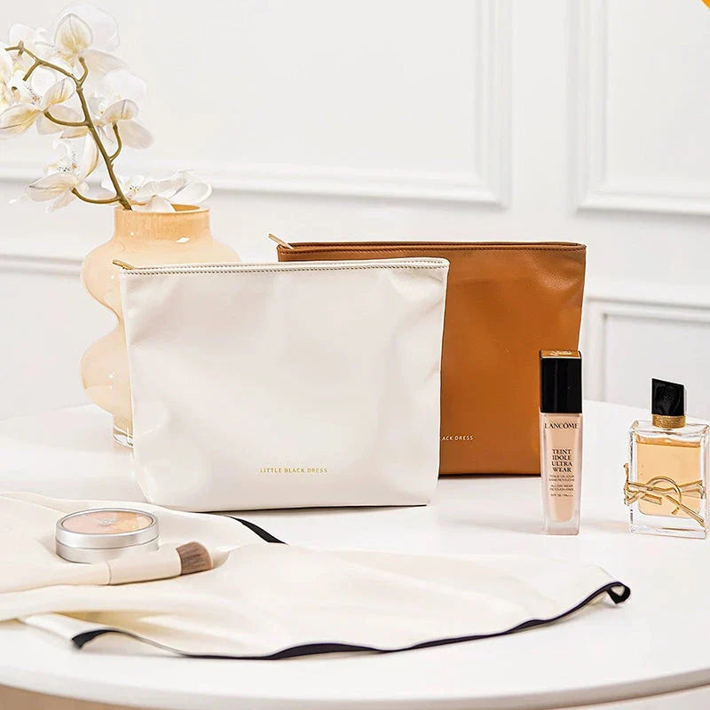 A versatile PU leather organiser bag in white and brown colours, designed to keep your daily essentials organised and your travels stylish.