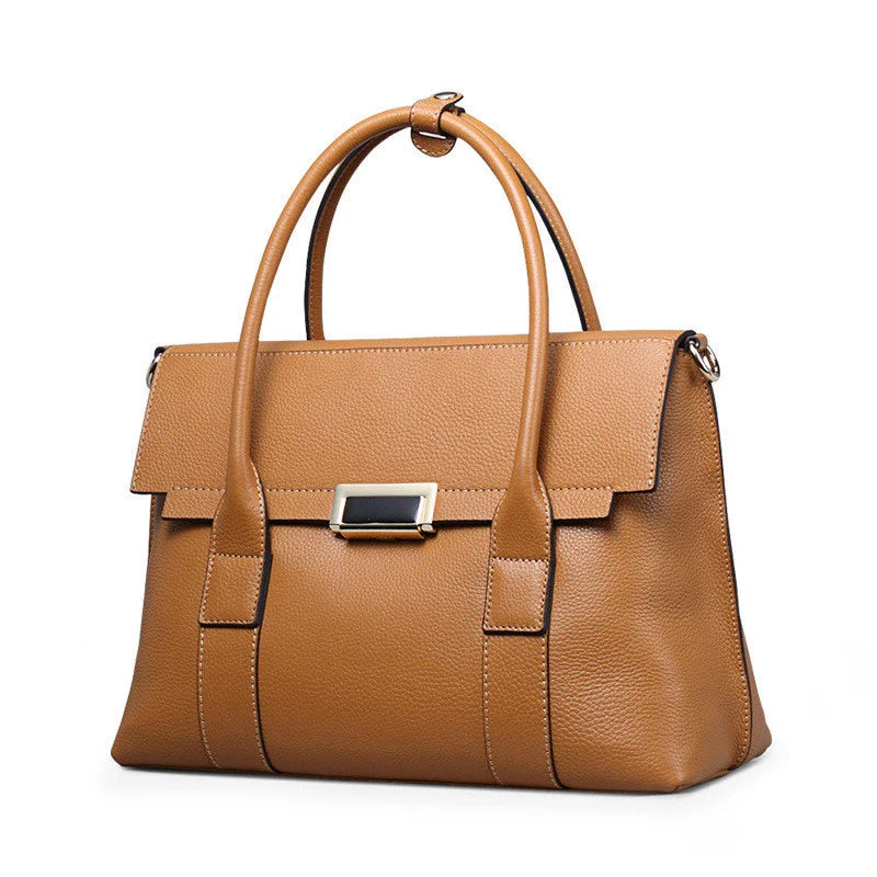 Premium first-layer cowhide leather shoulder bag with adjustable strap, spacious interior, and classic fashion design