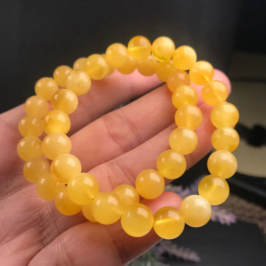 Elegant beeswax bracelets in a range of sizes, showcasing the natural beauty and premium craftsmanship of these premium Russian-inspired accessories.
