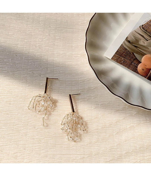 Elegant crystal grape cluster earrings with a cascading, geometric design in a premium gold finish
