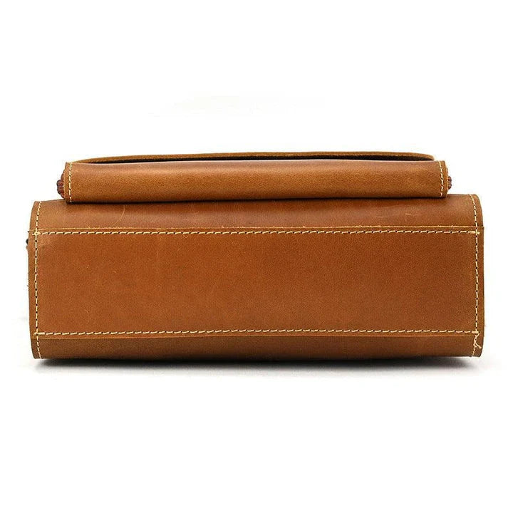 Premium leather crossbody bag with flap closure, vertical square shape, and multiple interior compartments