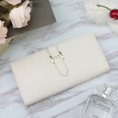 A stylish and practical long wallet made from premium leather, featuring a convenient drawstring closure to keep your essentials organised and secure.