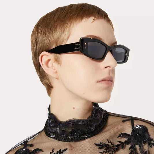 Retro cat eye sunglasses with rivet details, offering a stylish and protective eyewear solution.