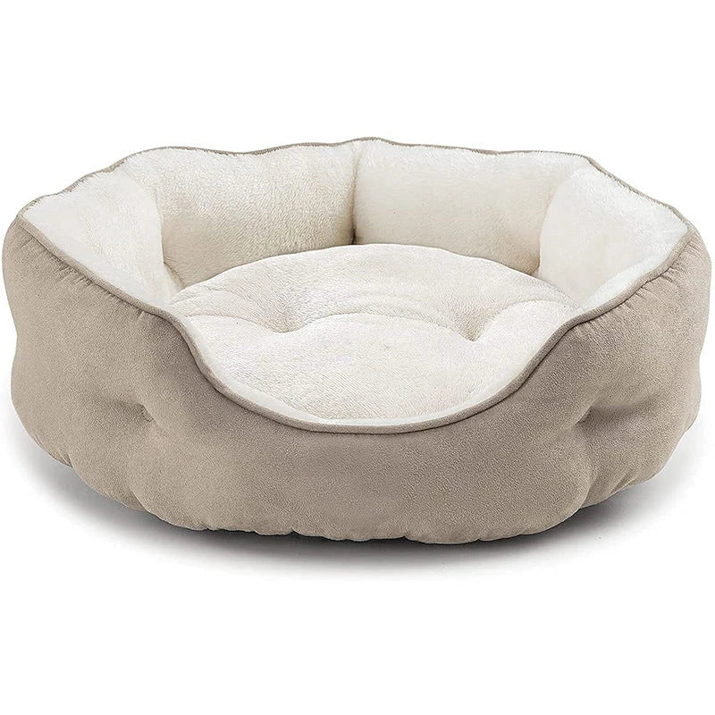 Cosy round pet bed made of soft microfibre fleece with a non-slip base, perfect for small dogs and cats to relax and sleep comfortably.