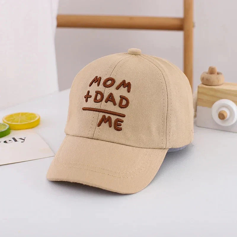 Adjustable cotton sun hat for kids with 'MOM+DAD=ME' embroidery, offering UV protection and breathable comfort
