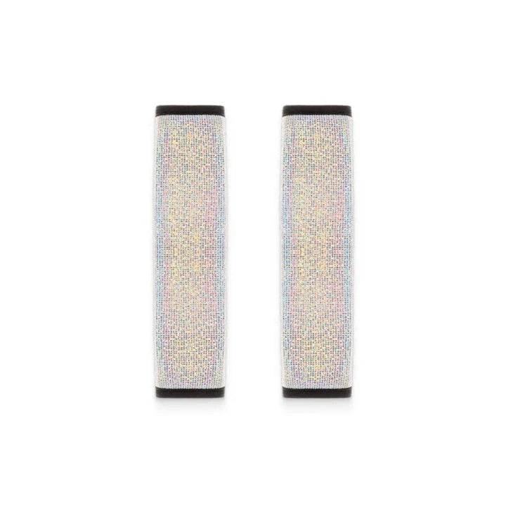 Multicoloured bling seat belt covers in a car, adding a touch of glamour and personality to the interior