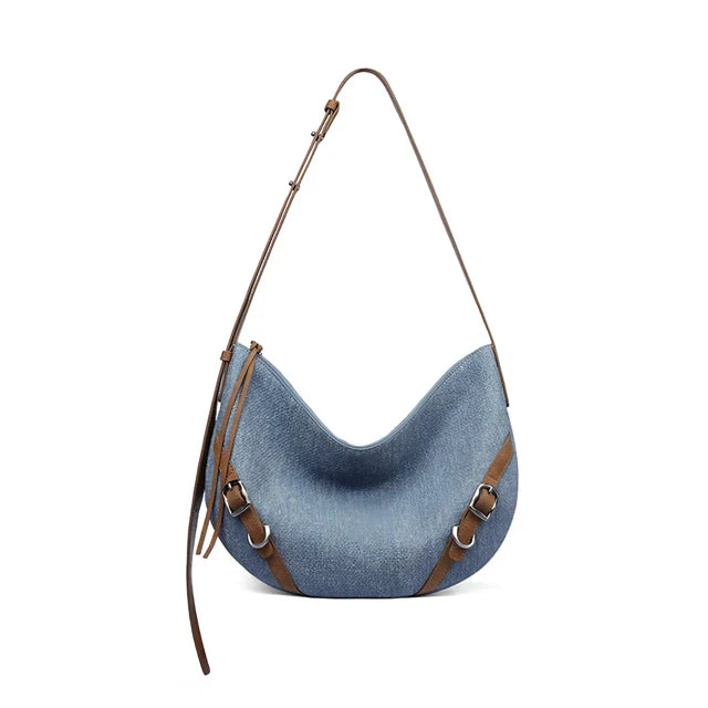 Elegant and versatile shoulder and crossbody bag in black, featuring a chic design, spacious compartments, and premium leather construction.