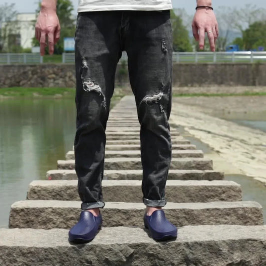 Premium waterproof men's short rain boots in various classic colours, including black, black and red, and dark blue