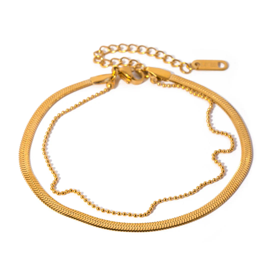 Exquisite 18K gold-plated double layer snake chain anklet with a durable stainless steel base, designed to elevate summer style with timeless elegance.