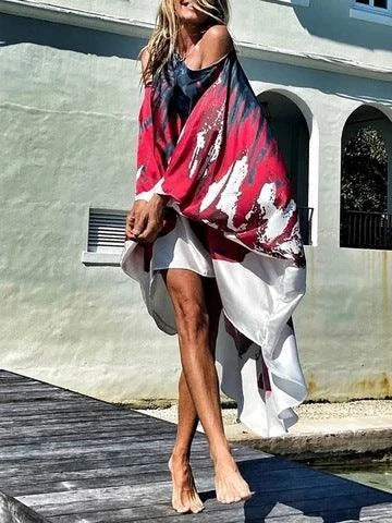 A chic inclined shoulder printed dress in a vibrant colour with a large, swinging skirt