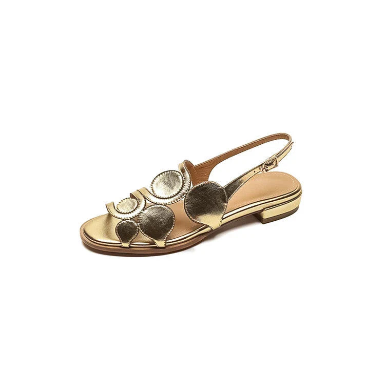 Chic sheepskin round toe sandals with a chunky heel and hollow out design, featuring a secure back strap and a modern, versatile style